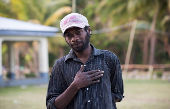 Man with hand on chest